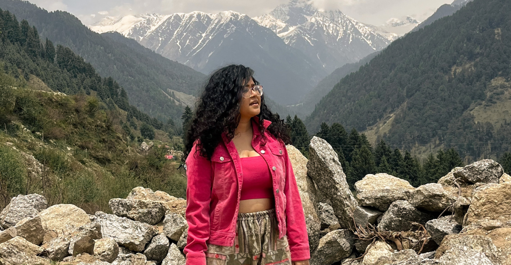 Girl standing on top of Mountain in Gir