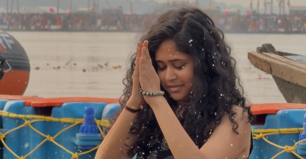 Girl praying at Mahakumbh