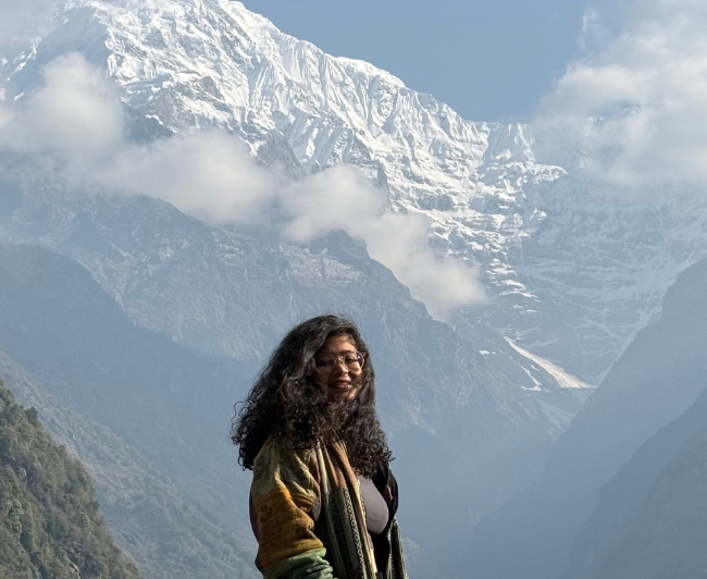 Girl posing in front of Annapurna Base Camp trek